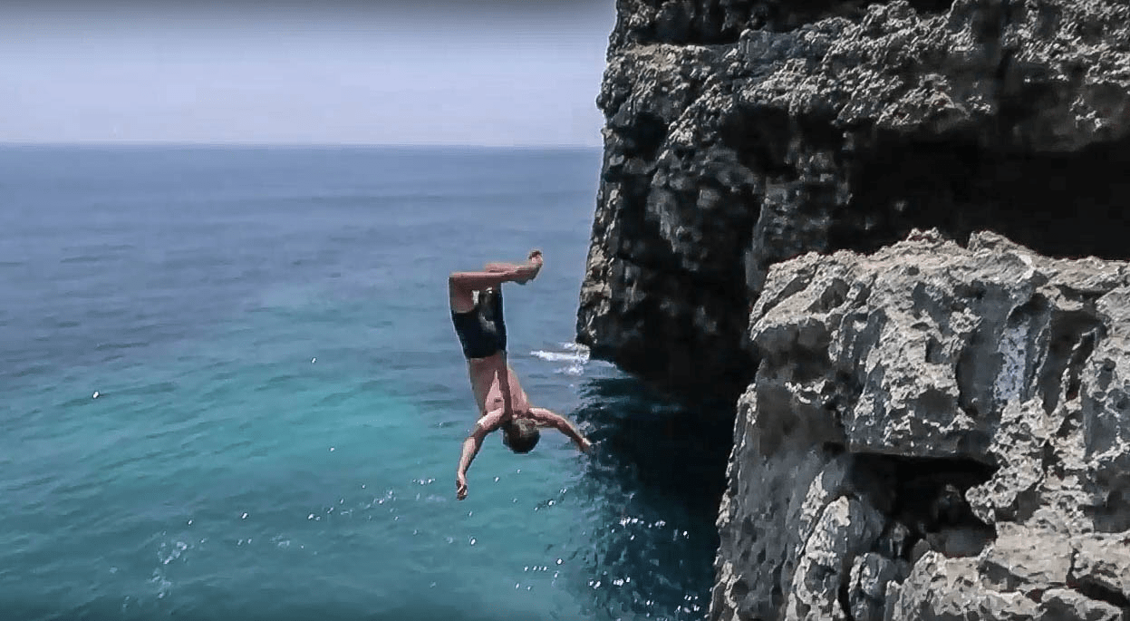 man lenny through paradise cliff jumping backflip from rock at fortune island nasugbu batangas philippines